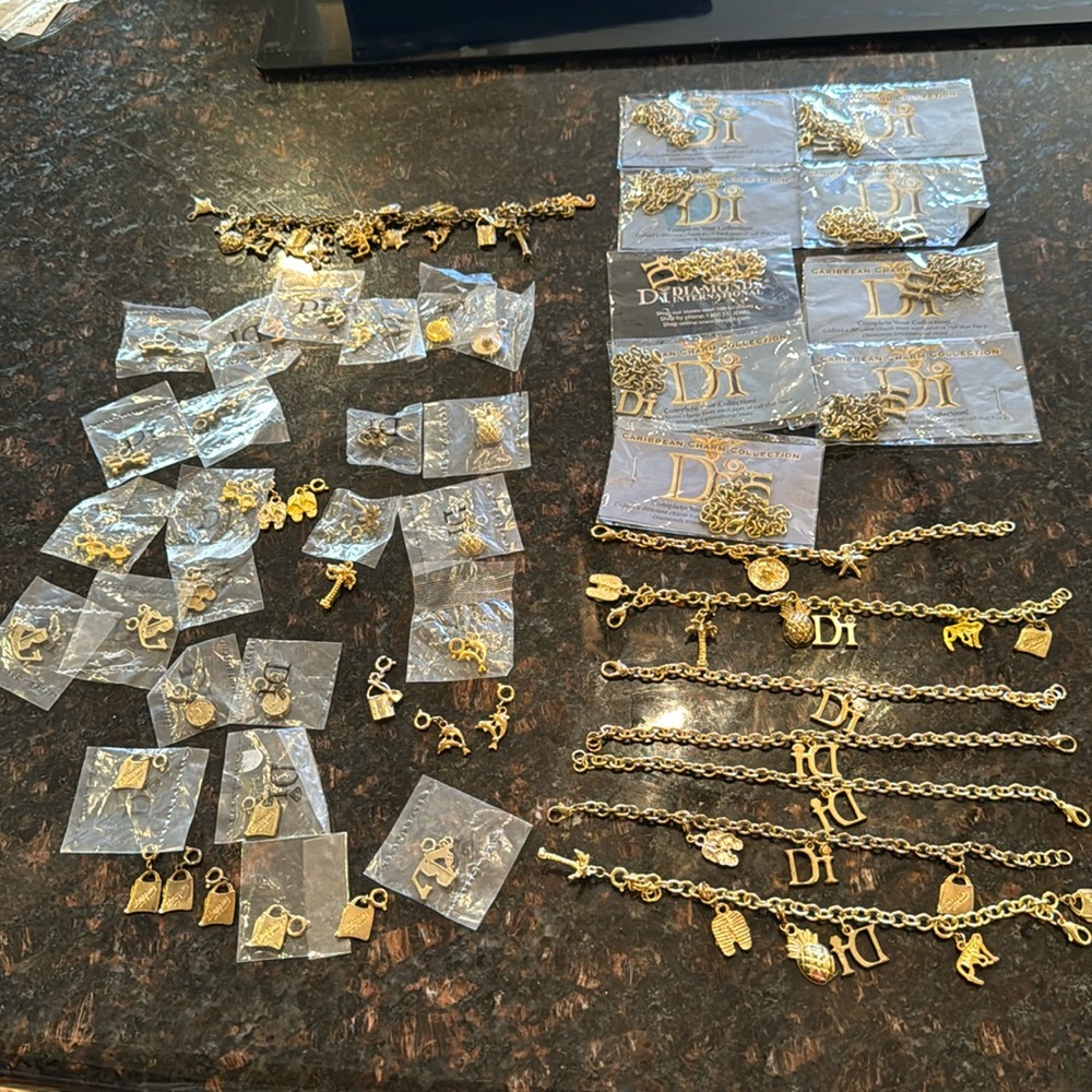 HUGE lot of Diamond international charms and bracelets.